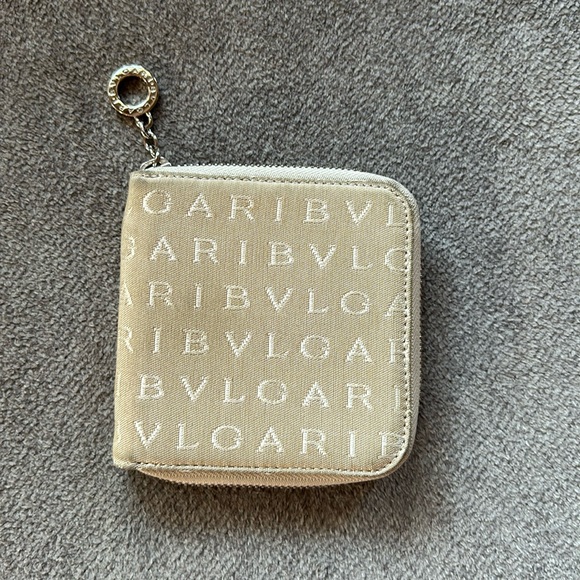 BVLGARI Handbags - Bvlgari used zippy wallet.  Beige logo style.  Good condition!